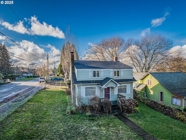 view of front of property with a front lawn