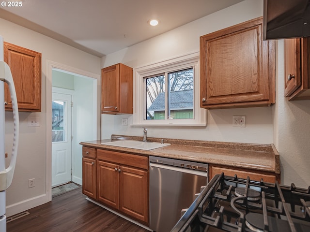 kitchen with stainless steel appliances, dark wood-type flooring, and sink