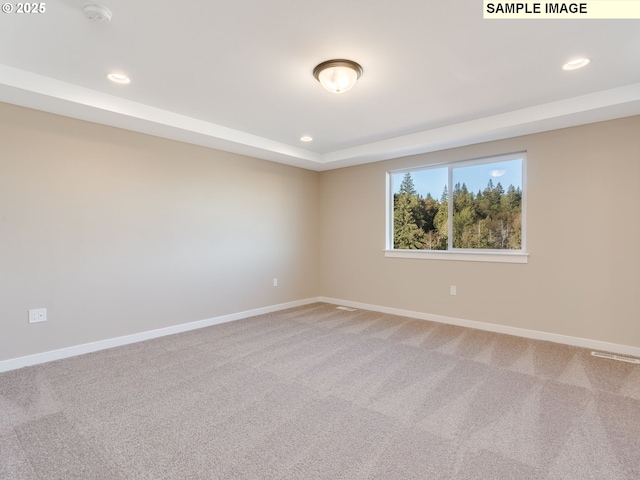 empty room with recessed lighting, baseboards, and carpet floors