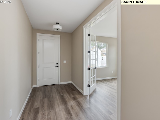 entryway with hardwood / wood-style flooring