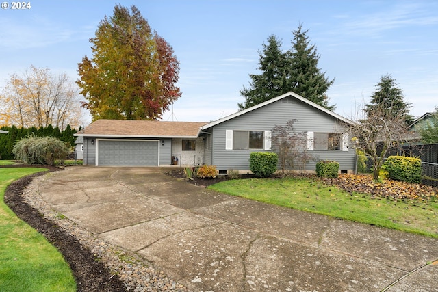 ranch-style house with a front lawn and a garage