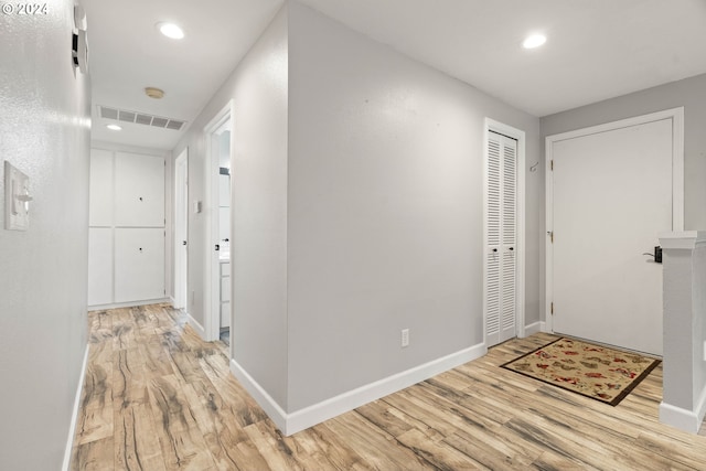 corridor featuring light hardwood / wood-style flooring