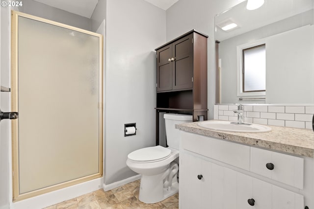 bathroom with decorative backsplash, vanity, toilet, and walk in shower