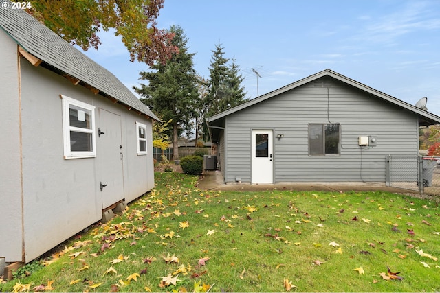 exterior space with a lawn and cooling unit