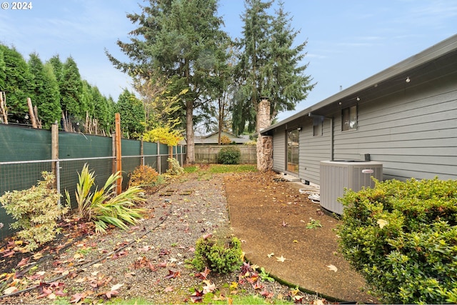 view of yard with central air condition unit