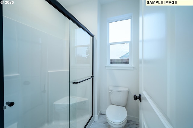 bathroom with toilet and walk in shower