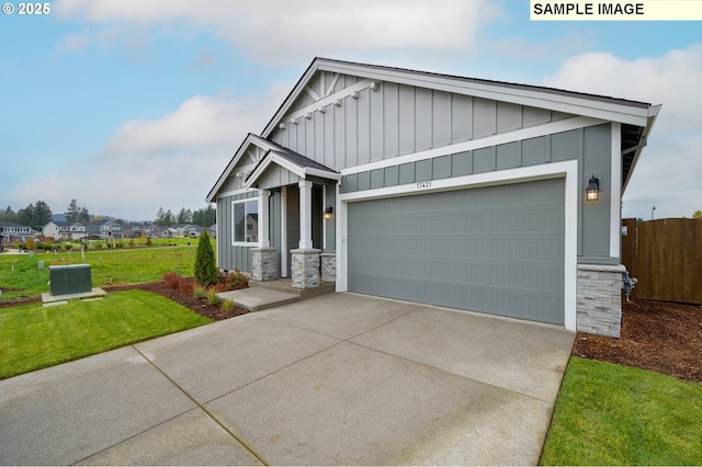 craftsman-style home with a front lawn and a garage