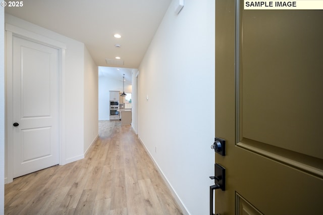 hall featuring light hardwood / wood-style floors