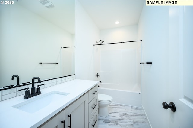 full bathroom featuring shower / bathing tub combination, vanity, and toilet