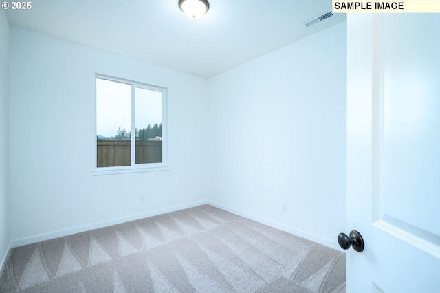 unfurnished room featuring carpet