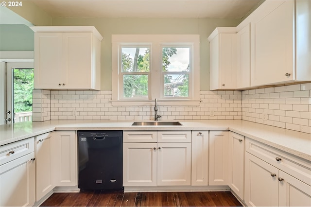 kitchen with dishwasher, sink, white cabinets, and a healthy amount of sunlight