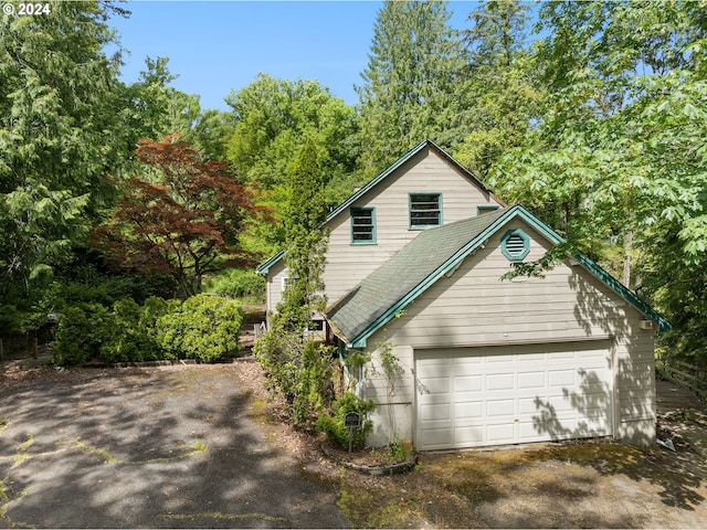 view of home's exterior with a garage