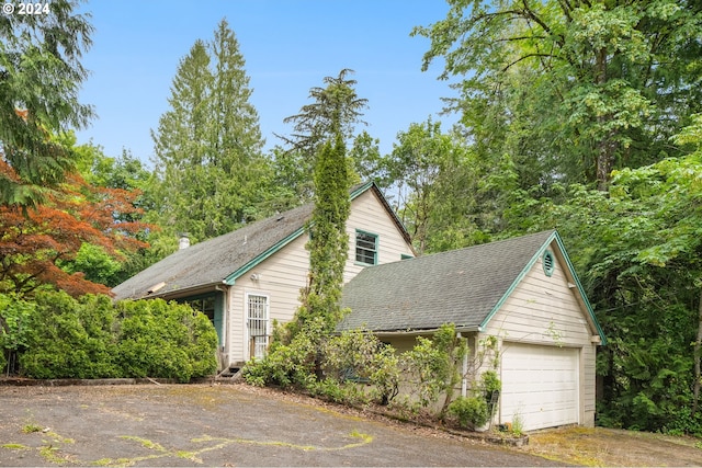 view of side of property with a garage