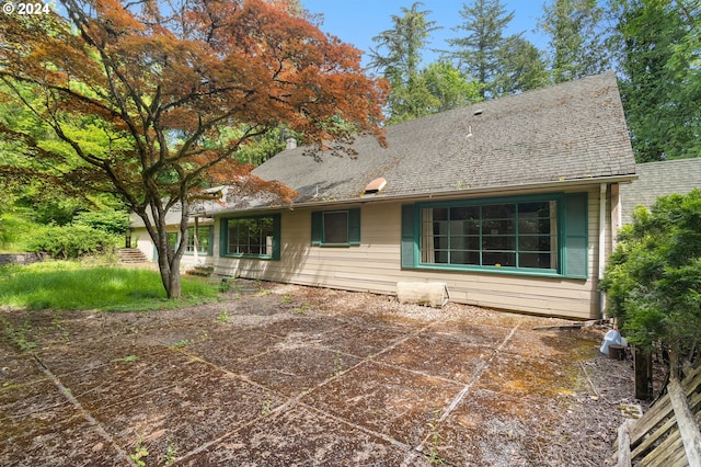 back of house with a patio