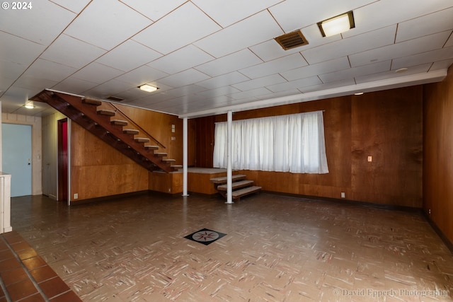 basement with wooden walls