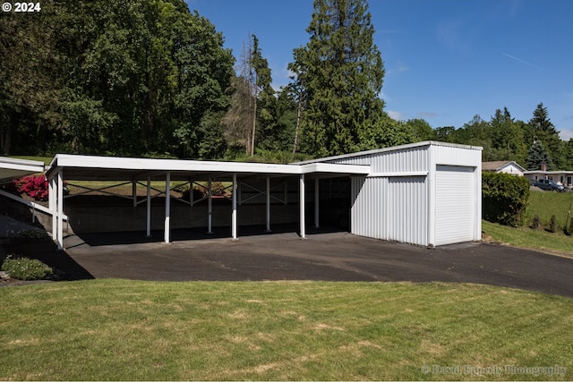 exterior space featuring a yard and a carport