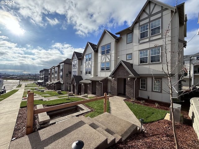 view of front of home with a balcony and a garage