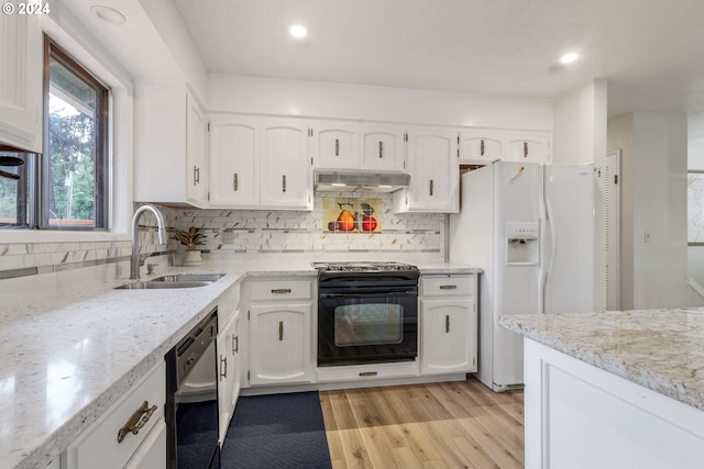 kitchen with white cabinets, electric range, white fridge with ice dispenser, stainless steel dishwasher, and sink