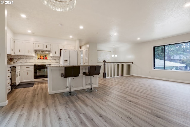 kitchen with black range oven, white fridge with ice dispenser, a center island, light wood-type flooring, and white cabinets