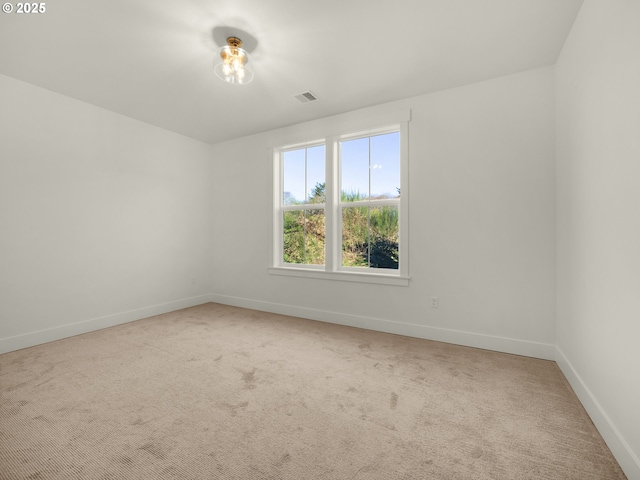 spare room featuring carpet