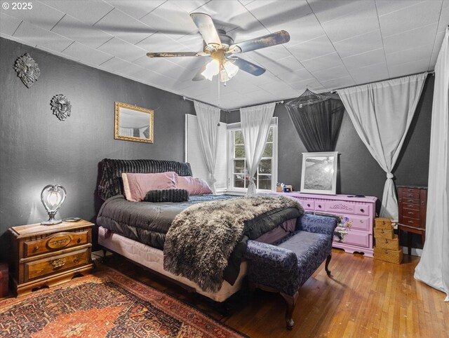 bedroom featuring ceiling fan and hardwood / wood-style flooring