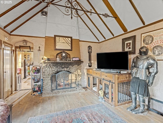 living room with beamed ceiling, high vaulted ceiling, a healthy amount of sunlight, and hardwood / wood-style flooring