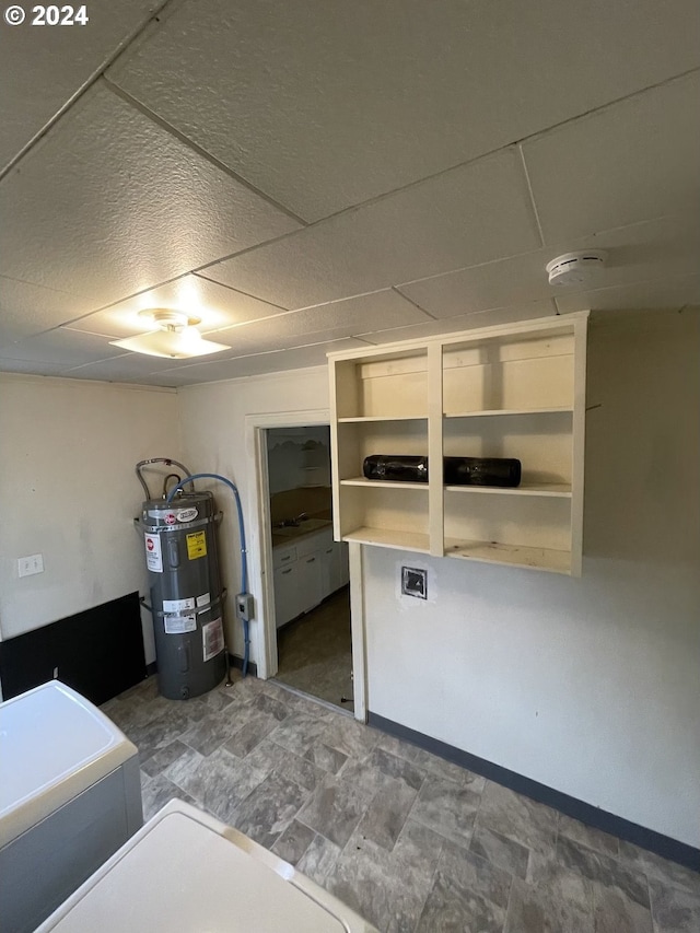 kitchen featuring a paneled ceiling and water heater