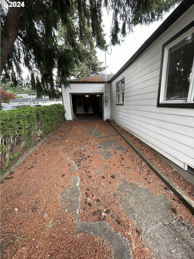 view of side of home with a garage