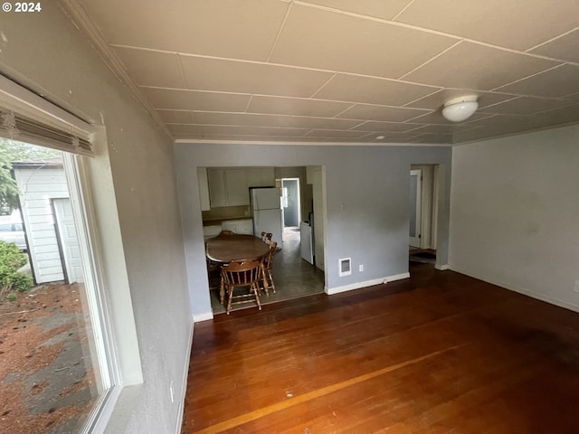 spare room with dark wood-type flooring