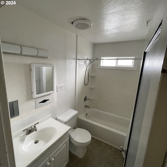 full bathroom with tile patterned flooring, a textured ceiling, shower / bath combination, toilet, and vanity