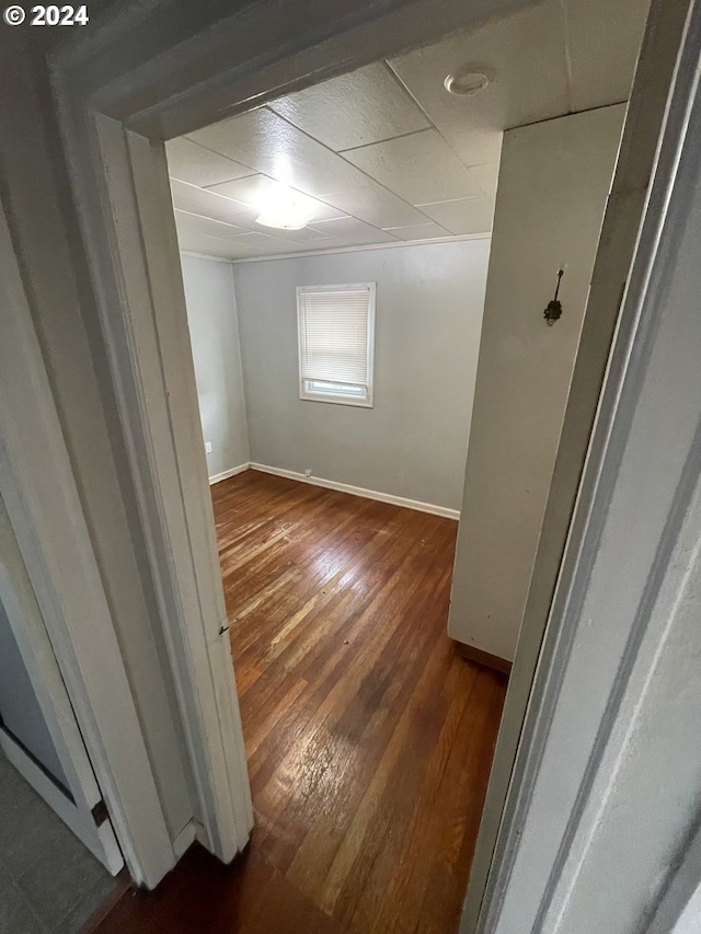 unfurnished room with dark wood-type flooring