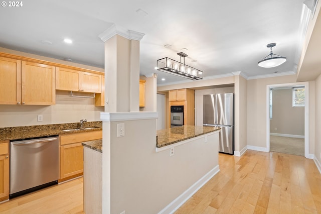 1205 SW Cardinell Dr Unit 802, Portland, OR 97201 - kitchen featuring stainless steel appliances, light brown cabinets, ornamental molding, light wood-type flooring, and dark stone counters