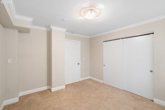 1205 SW Cardinell Dr Unit 802, Portland, OR 97201 - unfurnished bedroom with light carpet, ornamental molding, and a closet