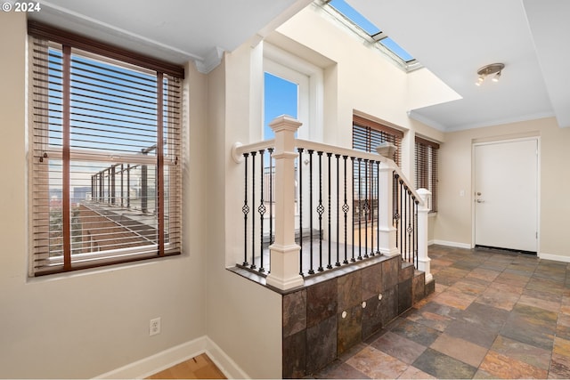1205 SW Cardinell Dr Unit 802, Portland, OR 97201 - stairs featuring stone finish floors, plenty of natural light, and ornamental molding