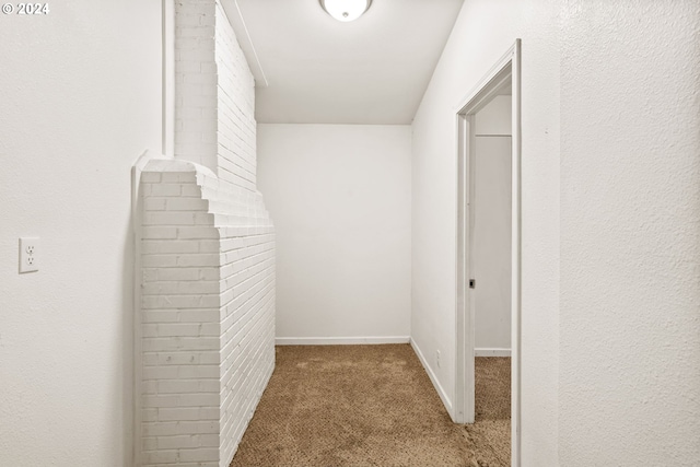 hallway with carpet flooring