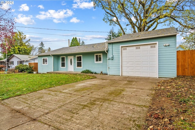 ranch-style home with a front lawn and a garage