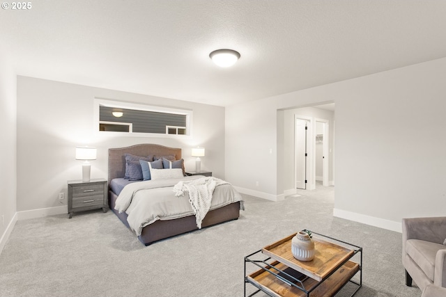 carpeted bedroom featuring a textured ceiling