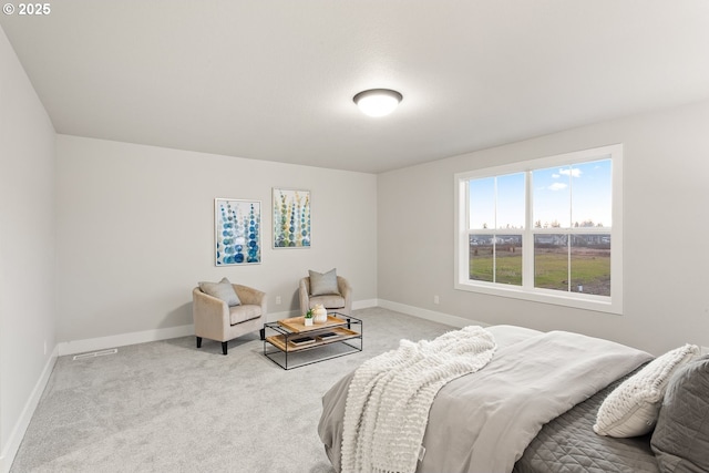 bedroom with light colored carpet