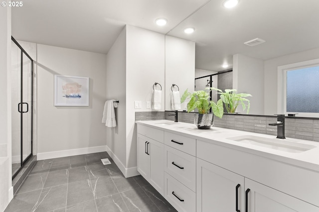 bathroom featuring walk in shower and vanity