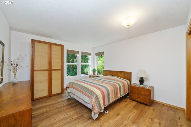 bedroom with light wood-type flooring