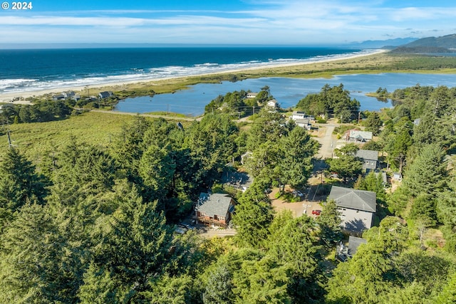 birds eye view of property featuring a water view and a view of the beach