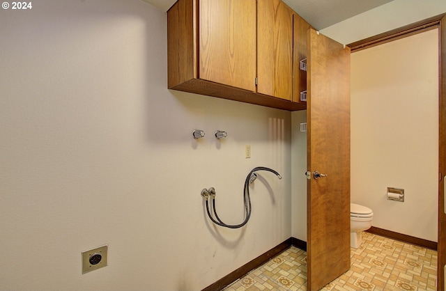 laundry area with hookup for a washing machine, cabinets, and hookup for an electric dryer