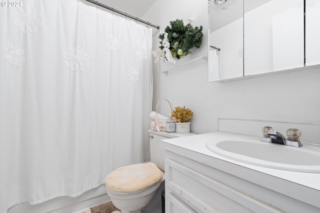 full bathroom featuring vanity, toilet, and shower / tub combo