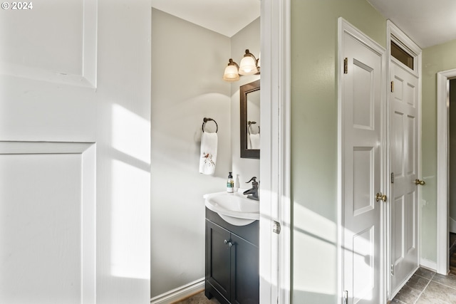 bathroom with oversized vanity and tile floors