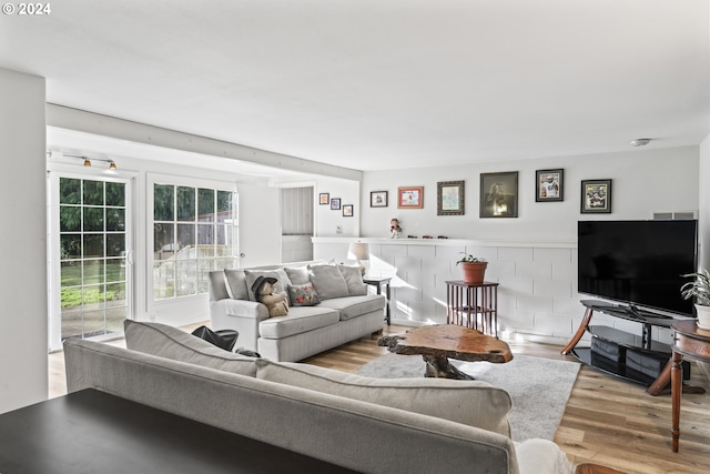 living room with light hardwood / wood-style flooring