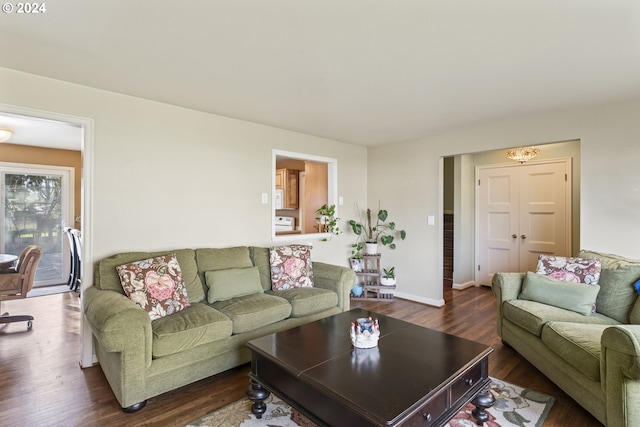 living room with dark hardwood / wood-style flooring