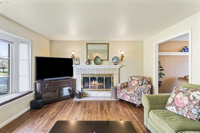 living room featuring dark hardwood / wood-style floors and a fireplace