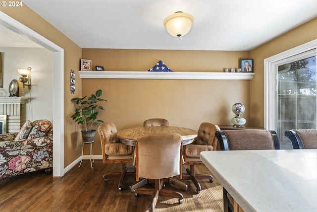 dining space featuring dark hardwood / wood-style flooring