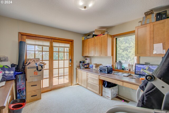 clothes washing area featuring light hardwood / wood-style floors, cabinets, sink, and washing machine and dryer