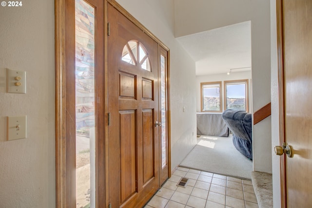 foyer with light carpet